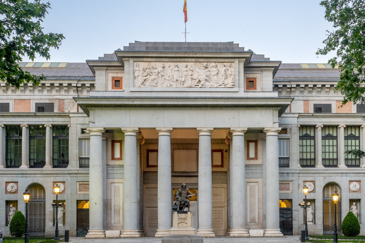 White colour building and statue in center