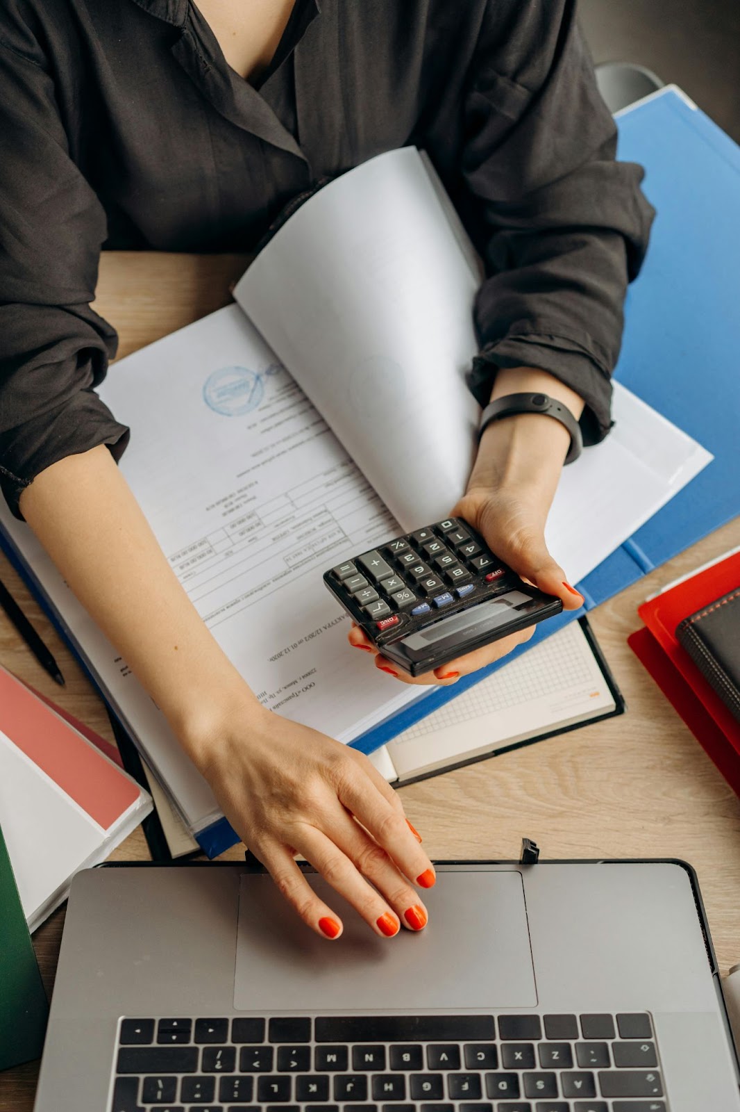 woman calculating roof bill