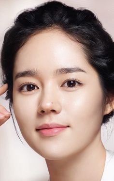 This contains an image of Han Ga putting on white dress smiling