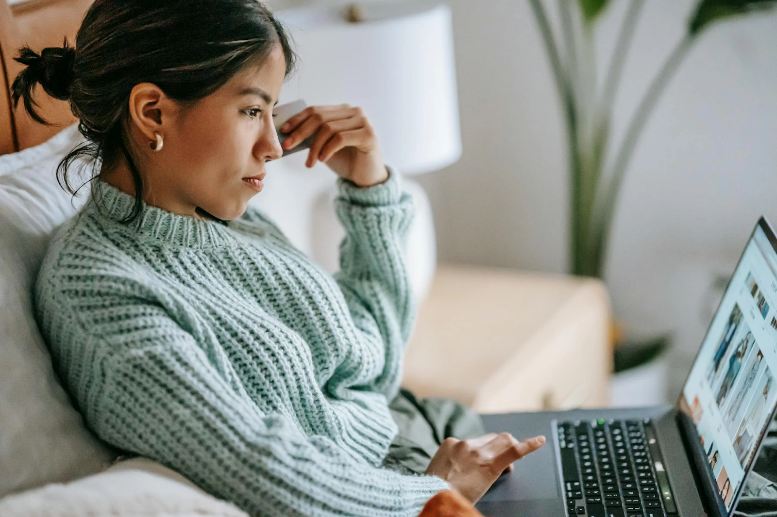 A young woman shops for clothes online