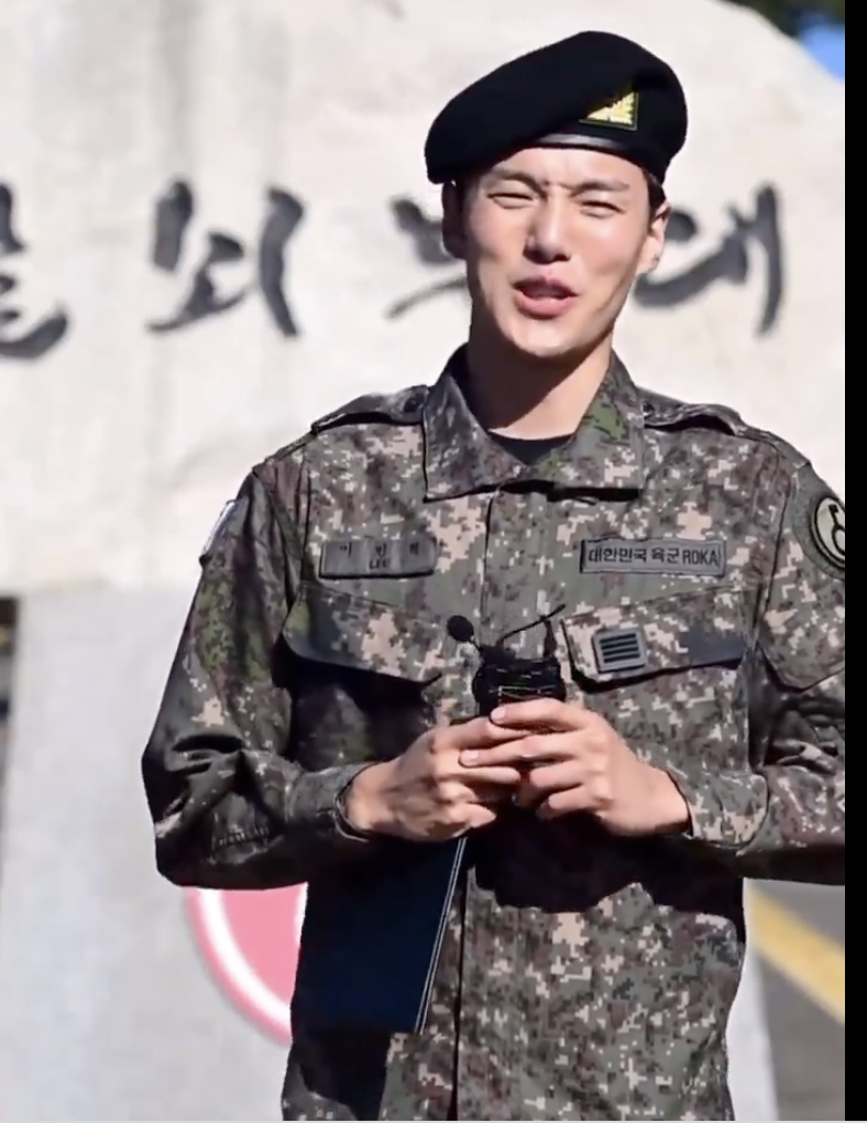 This is a photo of Minhyuk on military uniform during a live broadcast