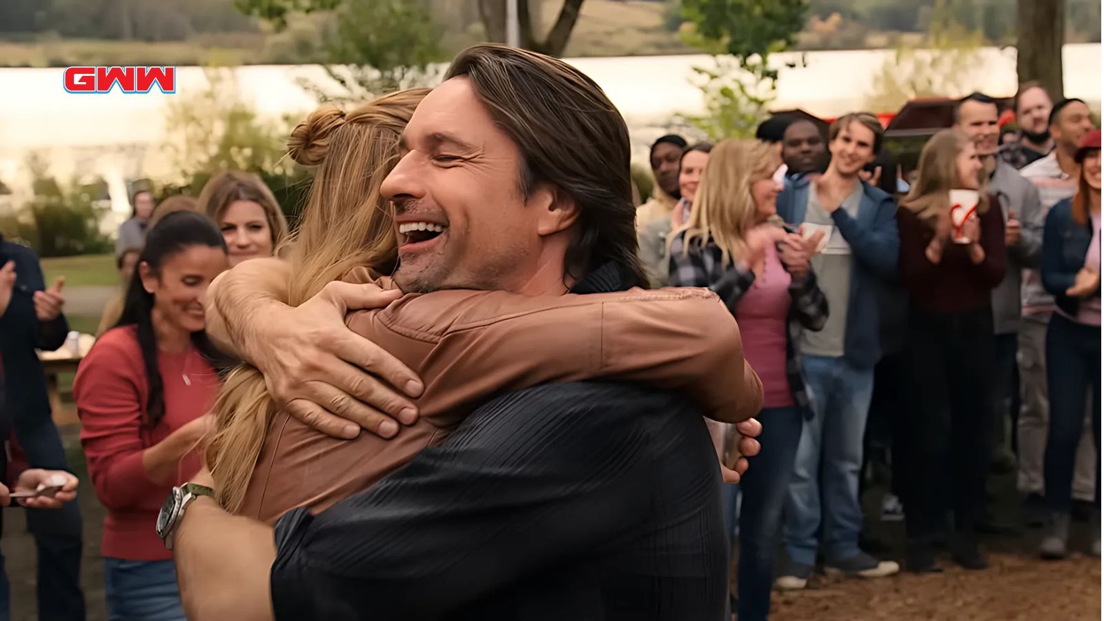 Martin Henderson hugging Alexandra Breckenridge in a joyful outdoor celebration