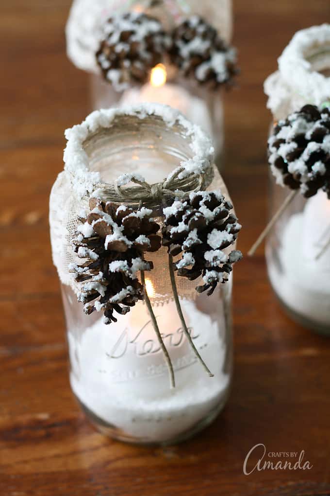 snowy pinecone candle jars