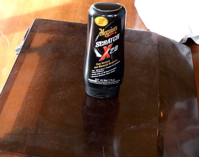 Meguiar's Scratch X2.0 on turntable dust cover for scratch removal.