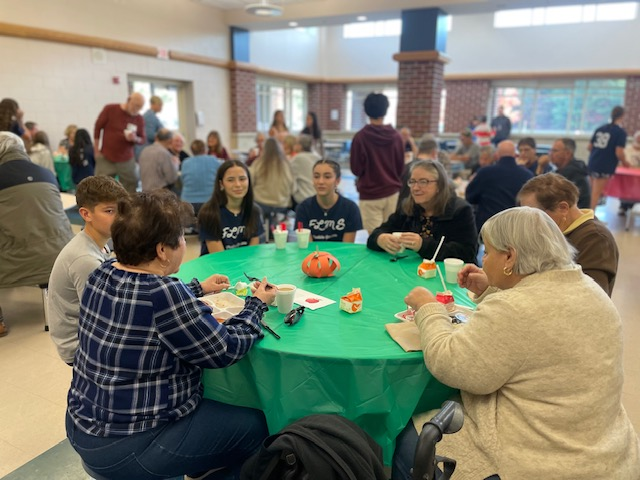 image of students and seniors at the Senior Breakfast.