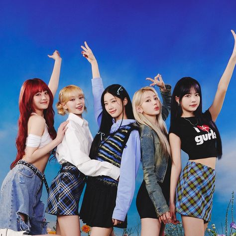 This contain the girls are posing in front of a blue sky