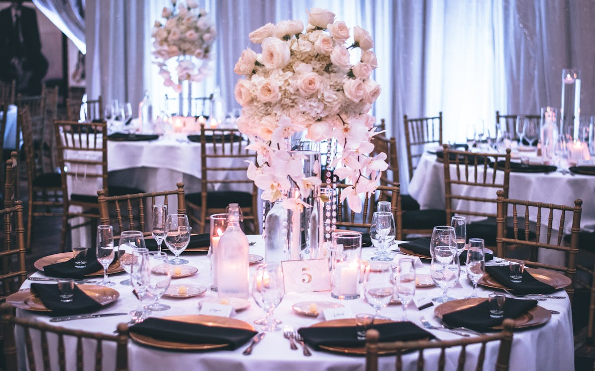 Photo by Tae Fuller: https://www.pexels.com/photo/pink-and-white-roses-centerpiece-on-top-of-table-1616113/ 