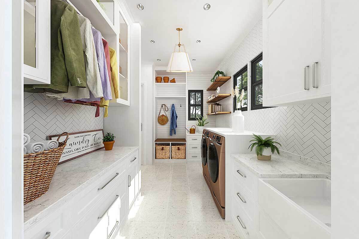 Laundry room with white built-ins, floating shelves, marble countertops, front-load appliances, and a utility sink.