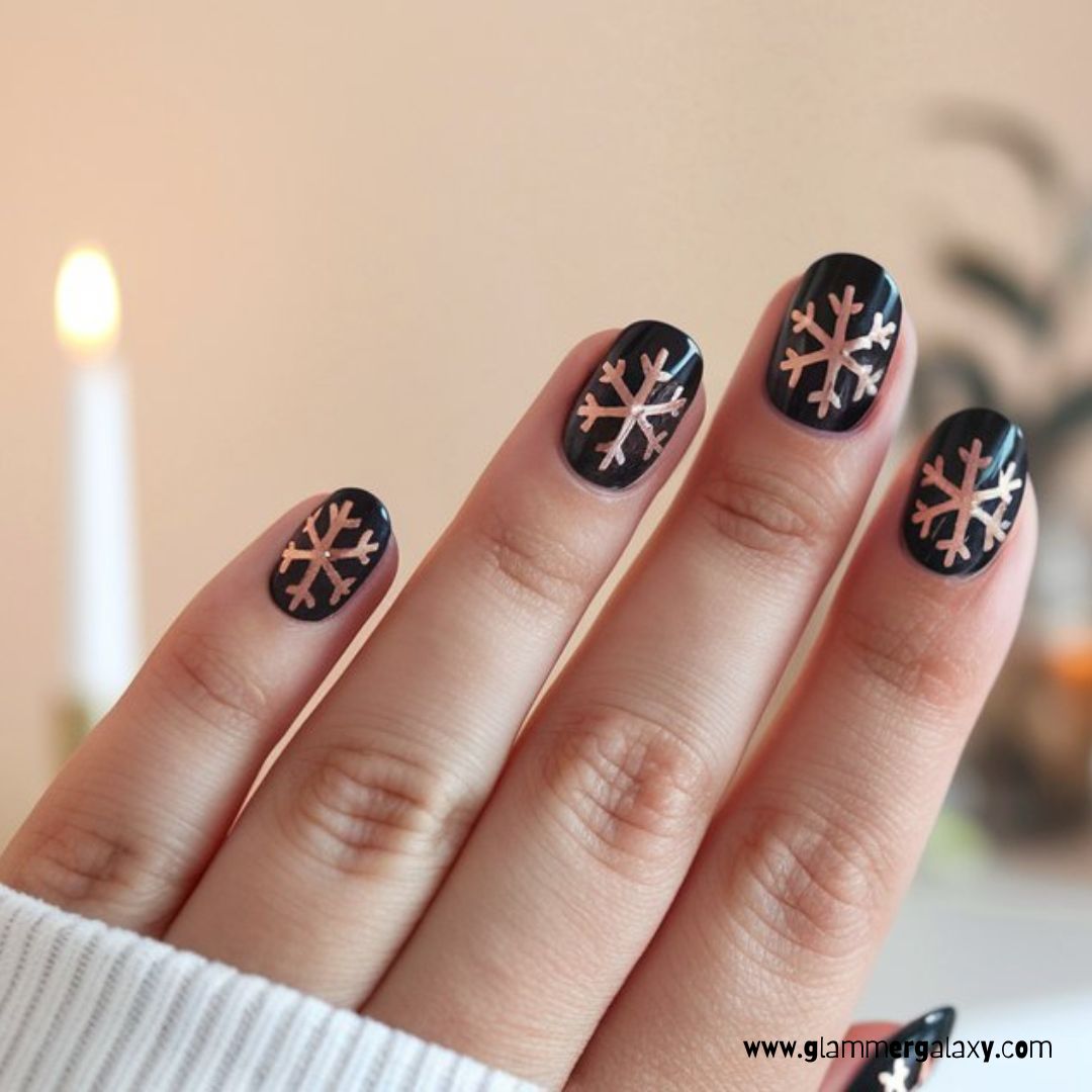 Black and Rose Gold Nail Designs having Winter Wonderland: Black with Rose Gold Snowflakes
