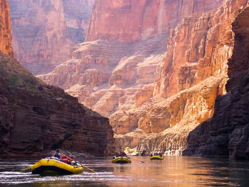 A group of people in rafts in a canyon

AI-generated content may be incorrect.