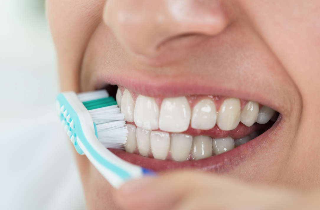 A Person brushing their teeth