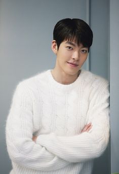 A photo of Actor Kim Woo-bin wearing a white hoodie 