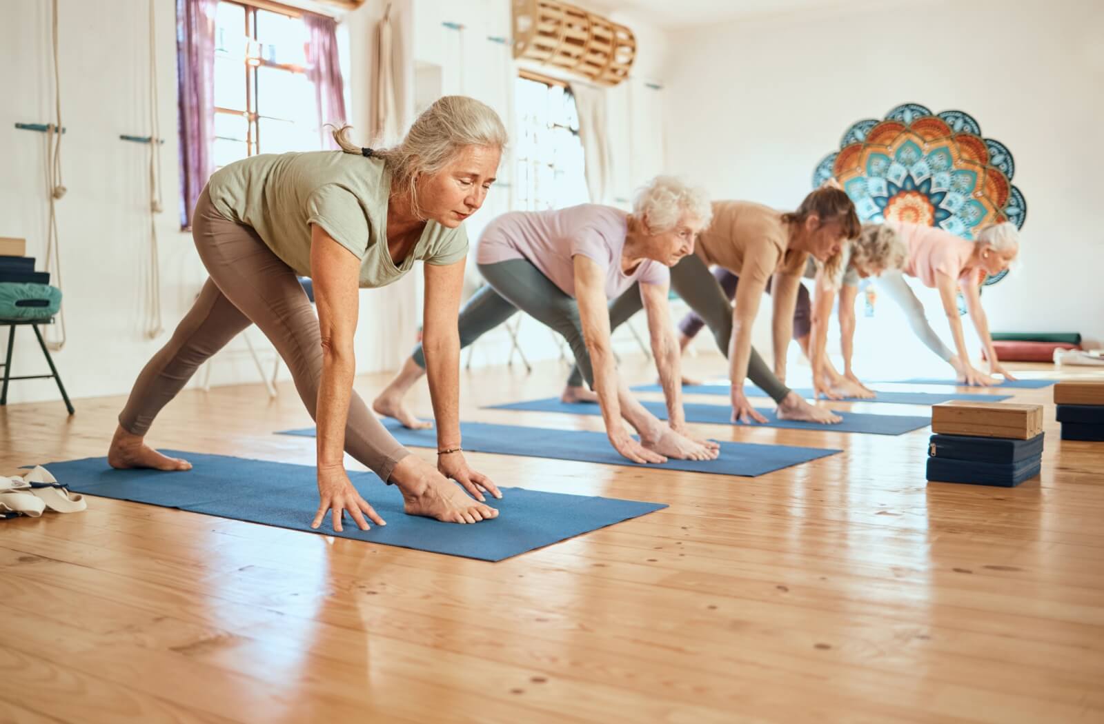 A group of senior women practicing yoga
