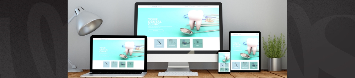 Desktop computer, laptop, tablet, and mobile phone displaying responsive website design.