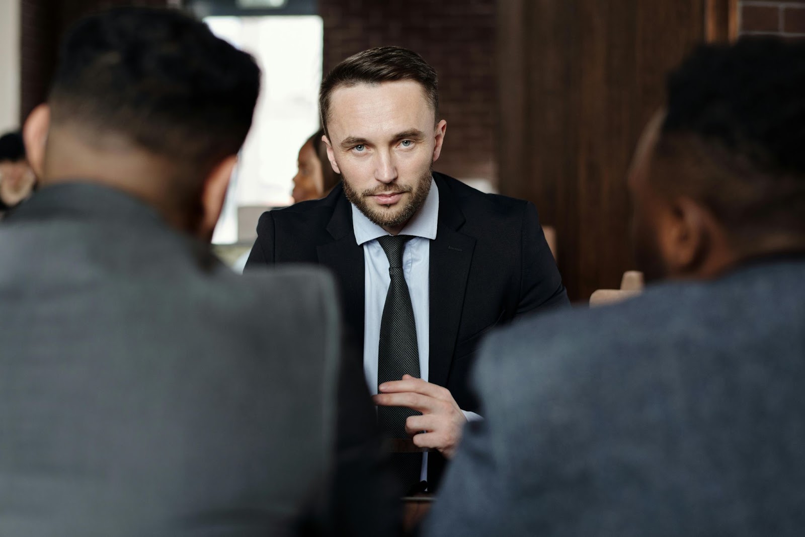 Three businessmen are in a meeting in a law office