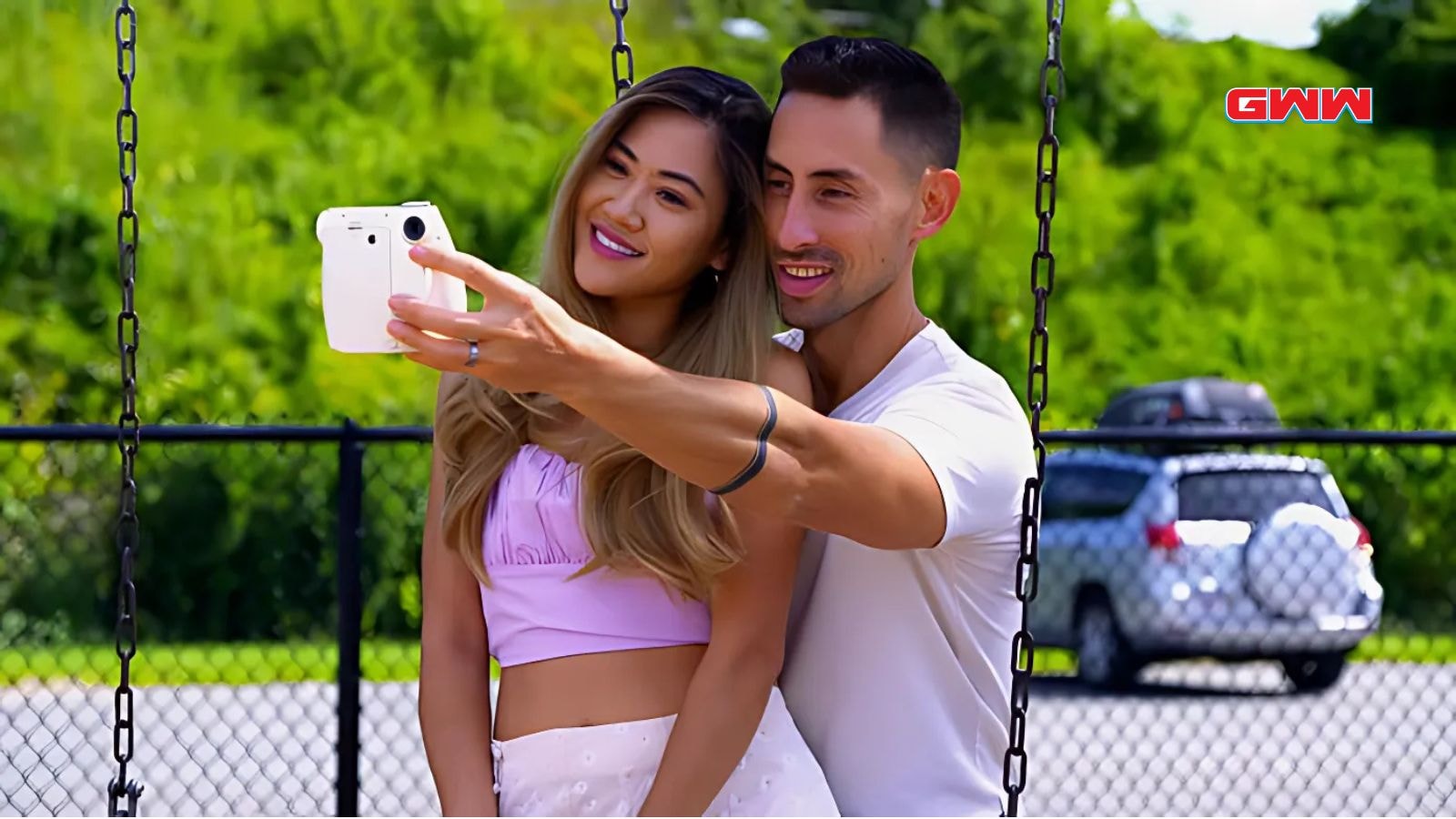 Matt Gwynne and Amber Bowles taking a selfie at a park