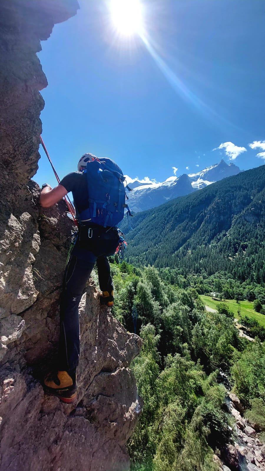 A person climbing a rockAI-generated content may be incorrect.