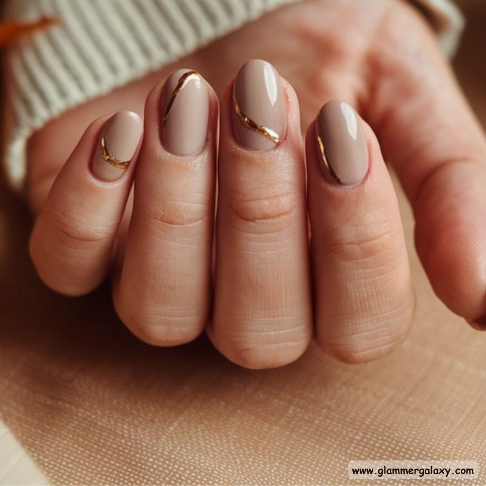 Neutral Fall Nails having Elegant Gold Highlights
