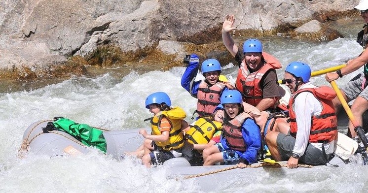 Group of scouts rafting down a river