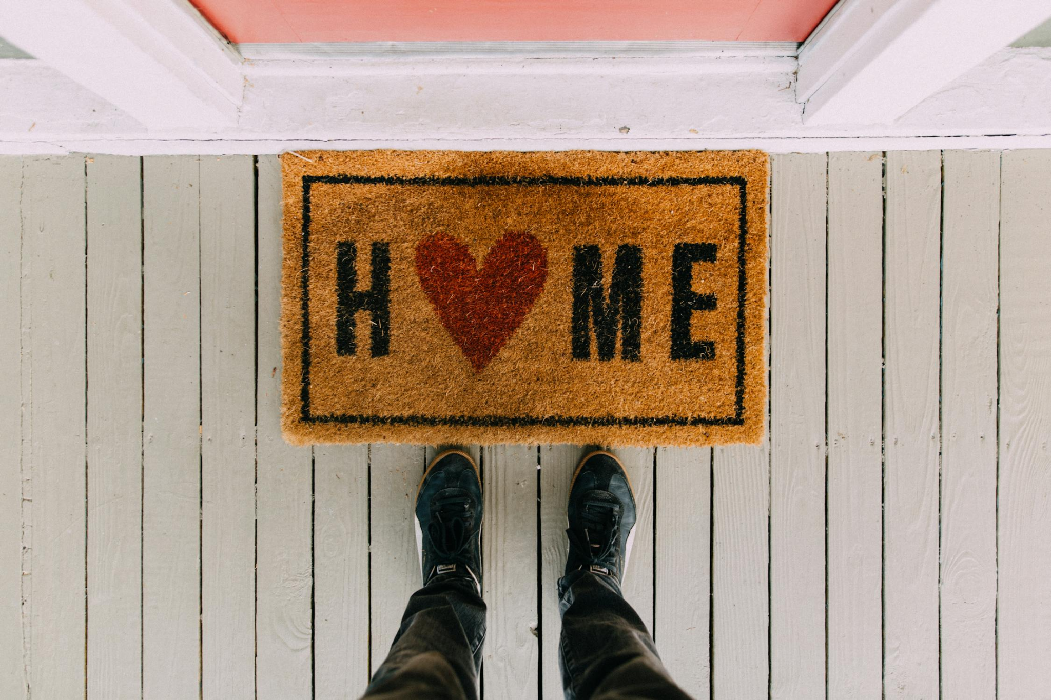 A welcoming front door mat with a cozy and stylish design, setting the tone for a refreshed and inviting home