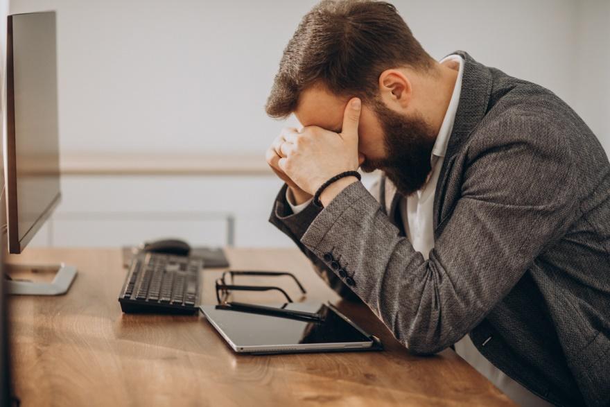 A businessman having a headache.