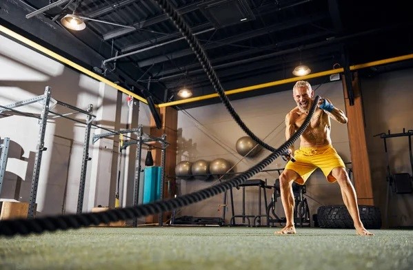 a man doing exercise at a 40ft container gym 