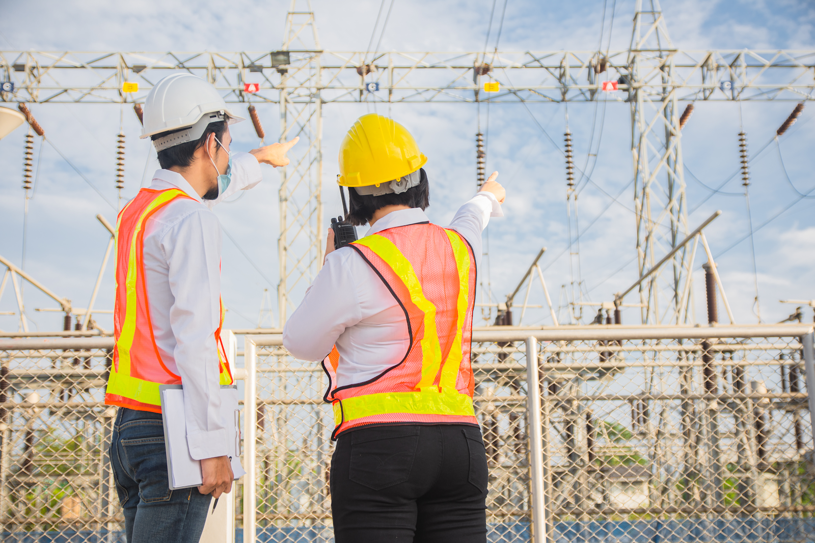 two electrical workers on site