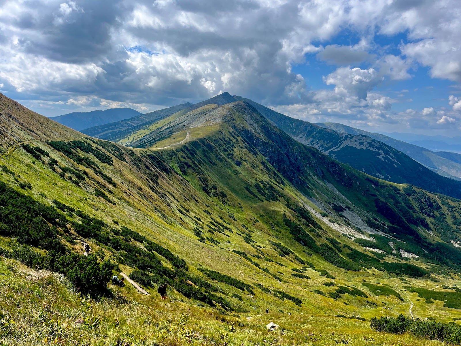 The peaks of Low Tatras, Slovakia, under a blue sky.