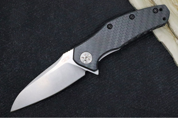 An image showing the Zero Tolerance 0770CF, an assisted opening pocket knife. The handle features a honeycomb pattern for a comfortable and secure grip.