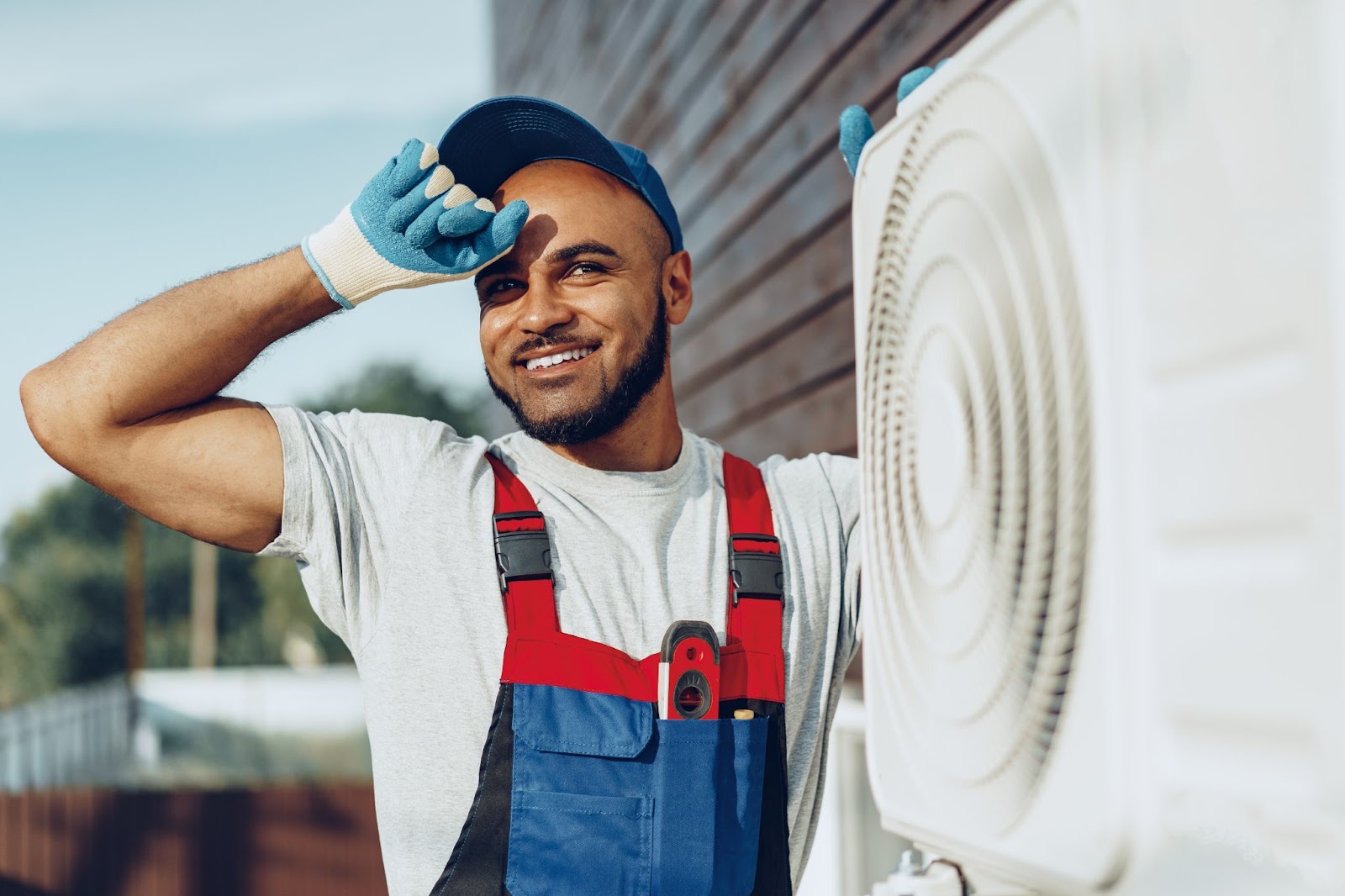 Technician working on an AC unit. 