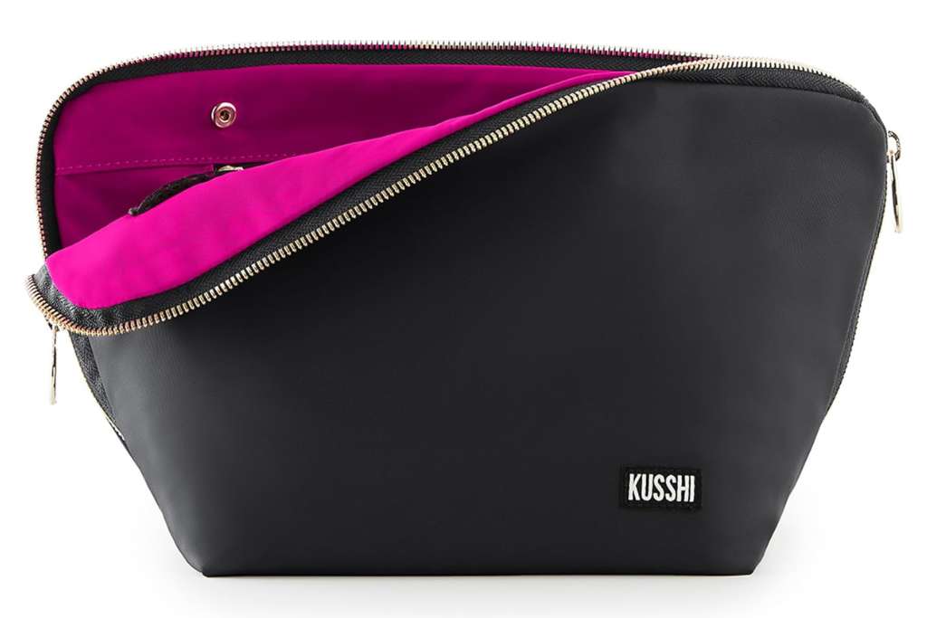 black bag with gold zipper and pink interior