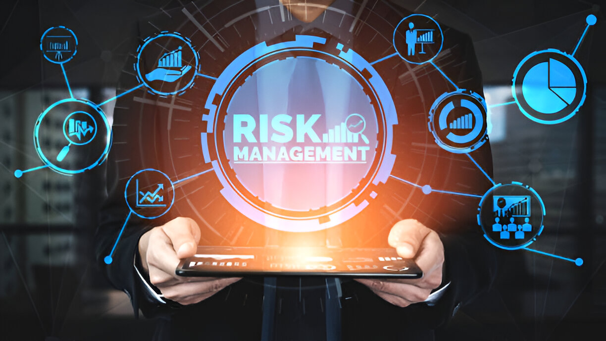 Business professional holding a tablet with interconnected icons representing risk management in budgeting and financial planning.