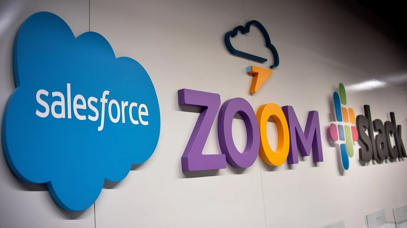 Logos of top SaaS providers like Salesforce, Zoom, and Slack, with clouds above each representing their SaaS solutions