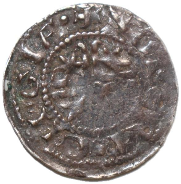 A close-up of a coin

Description automatically generated