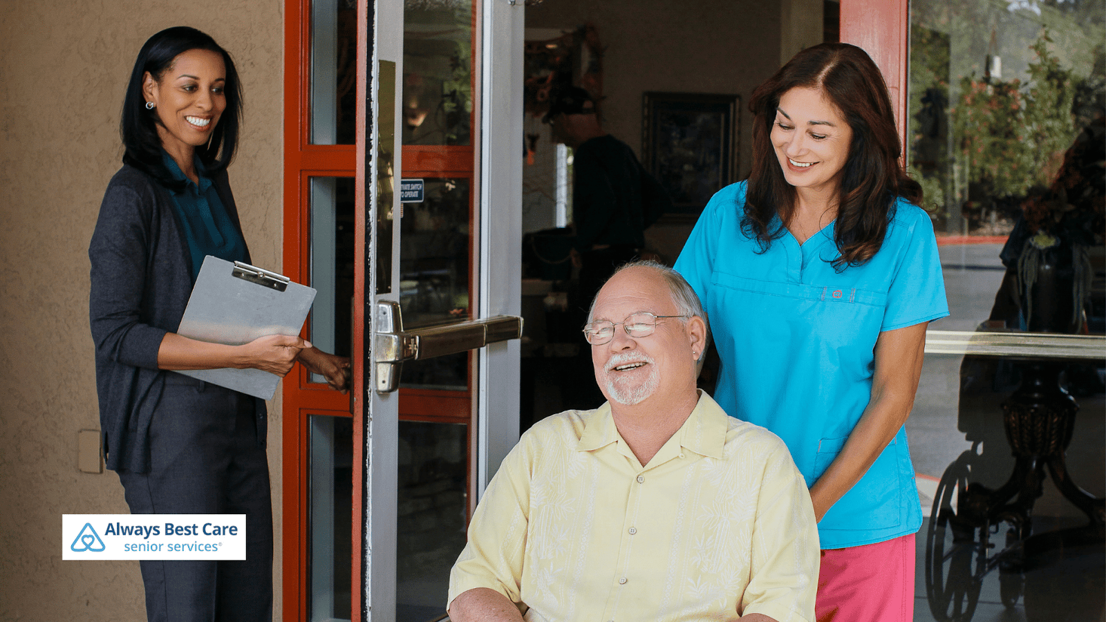 This image depicts a caregiver helping a senior man move in a stroller