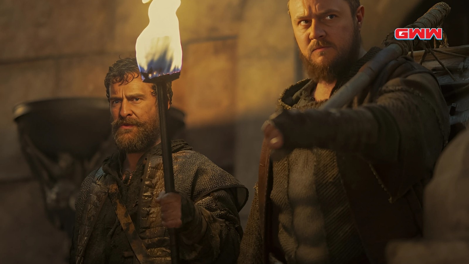 Paul Kennedy and Anthony Flanagan wield torches during tense castle scene