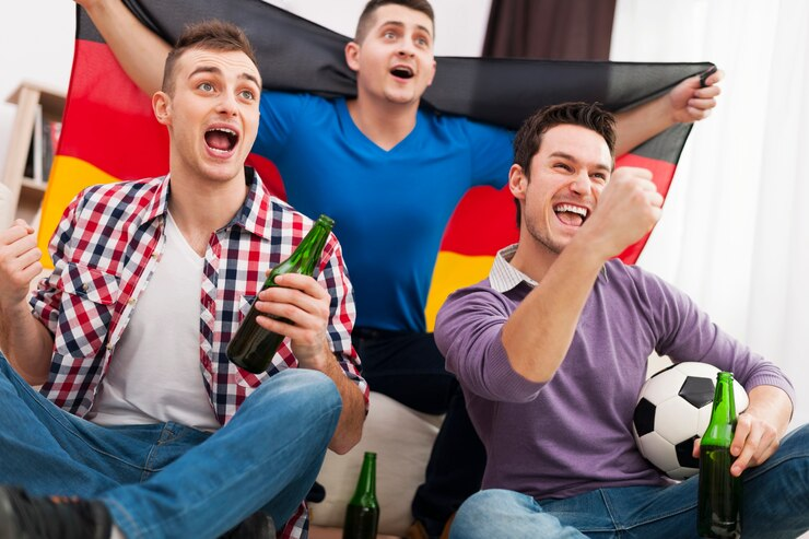 people celebrating a football win