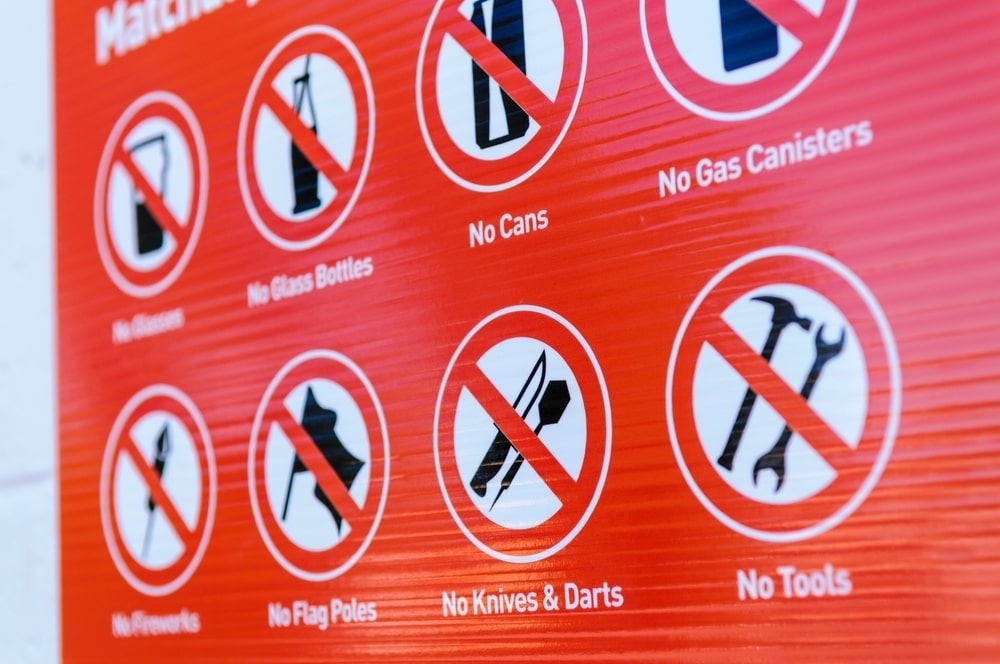 Prohibited items listed on a red poster