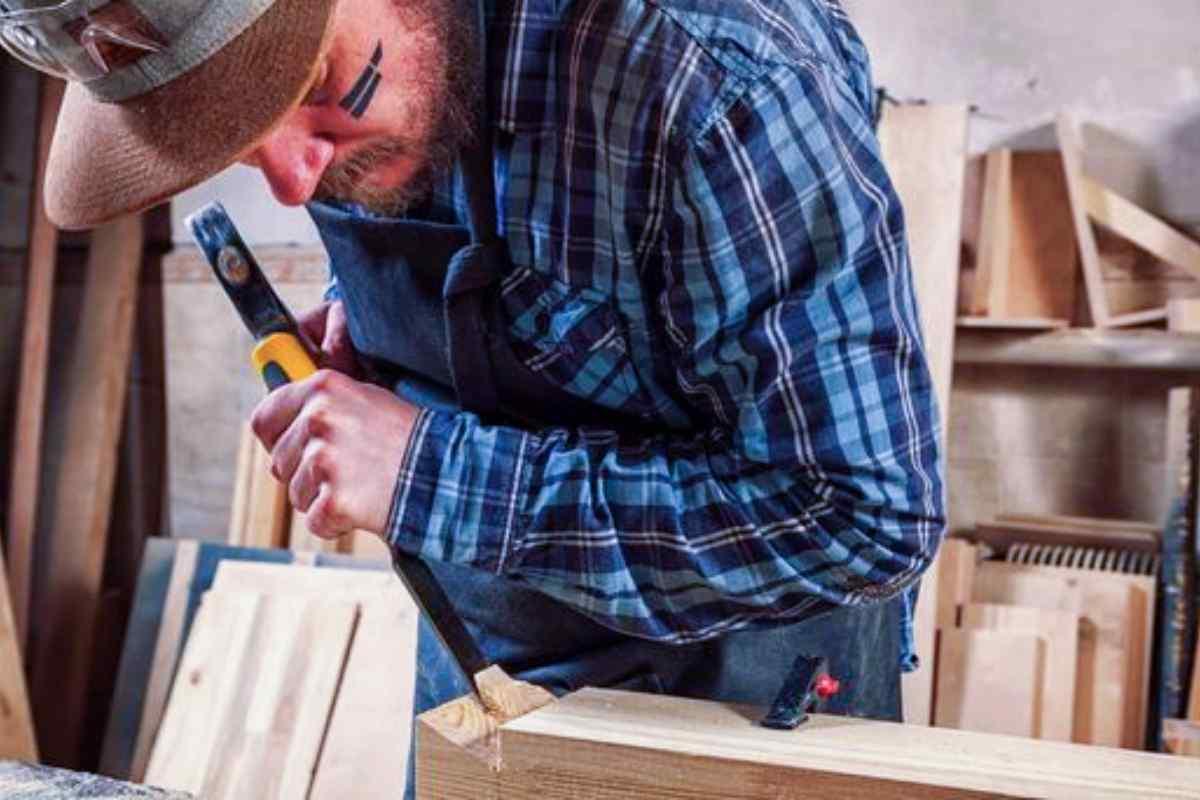 stock-photo-close-experienced-carpenter-work-clothes-small-buiness-owner-working-woodwork