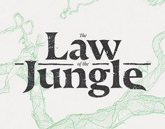 This contains an image of the law of the jungle logo shown in black and green on a white background