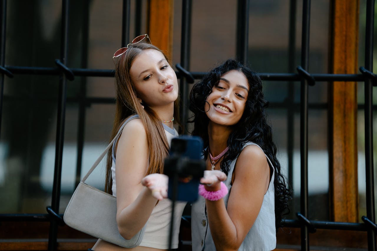 Two women smiling and posing for a selfie