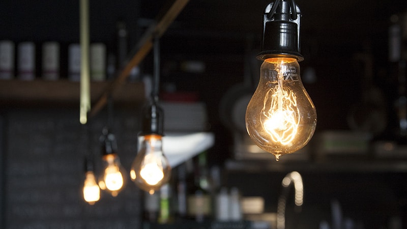 Incandescent Light Bulbs Suspended in a Warehouse