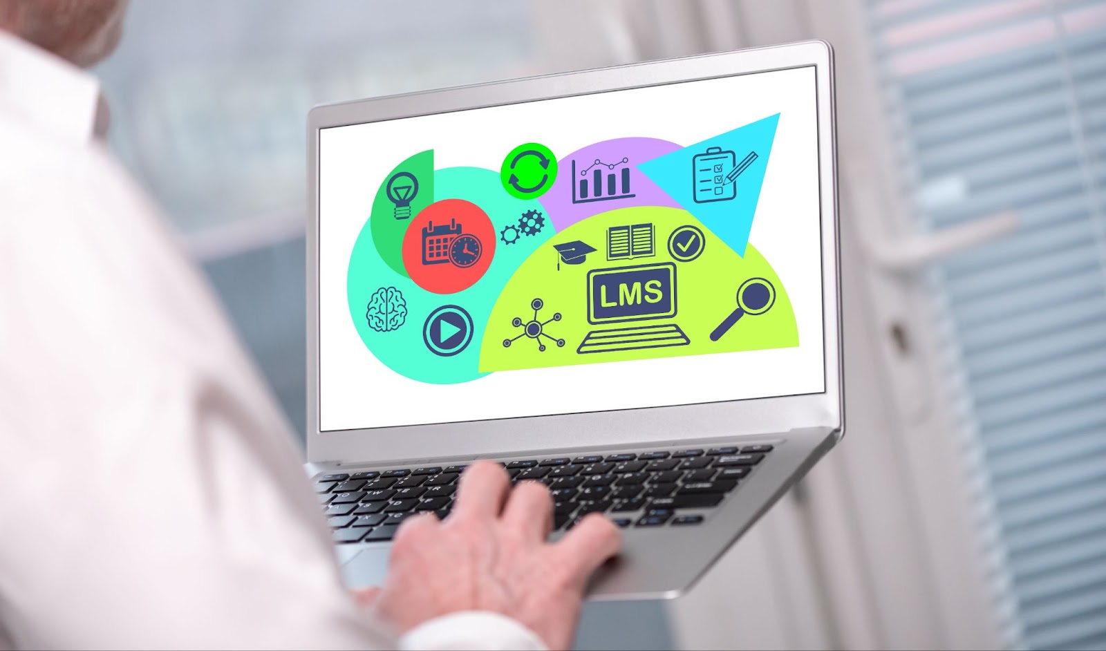 Lms concept shown on a laptop used by a man