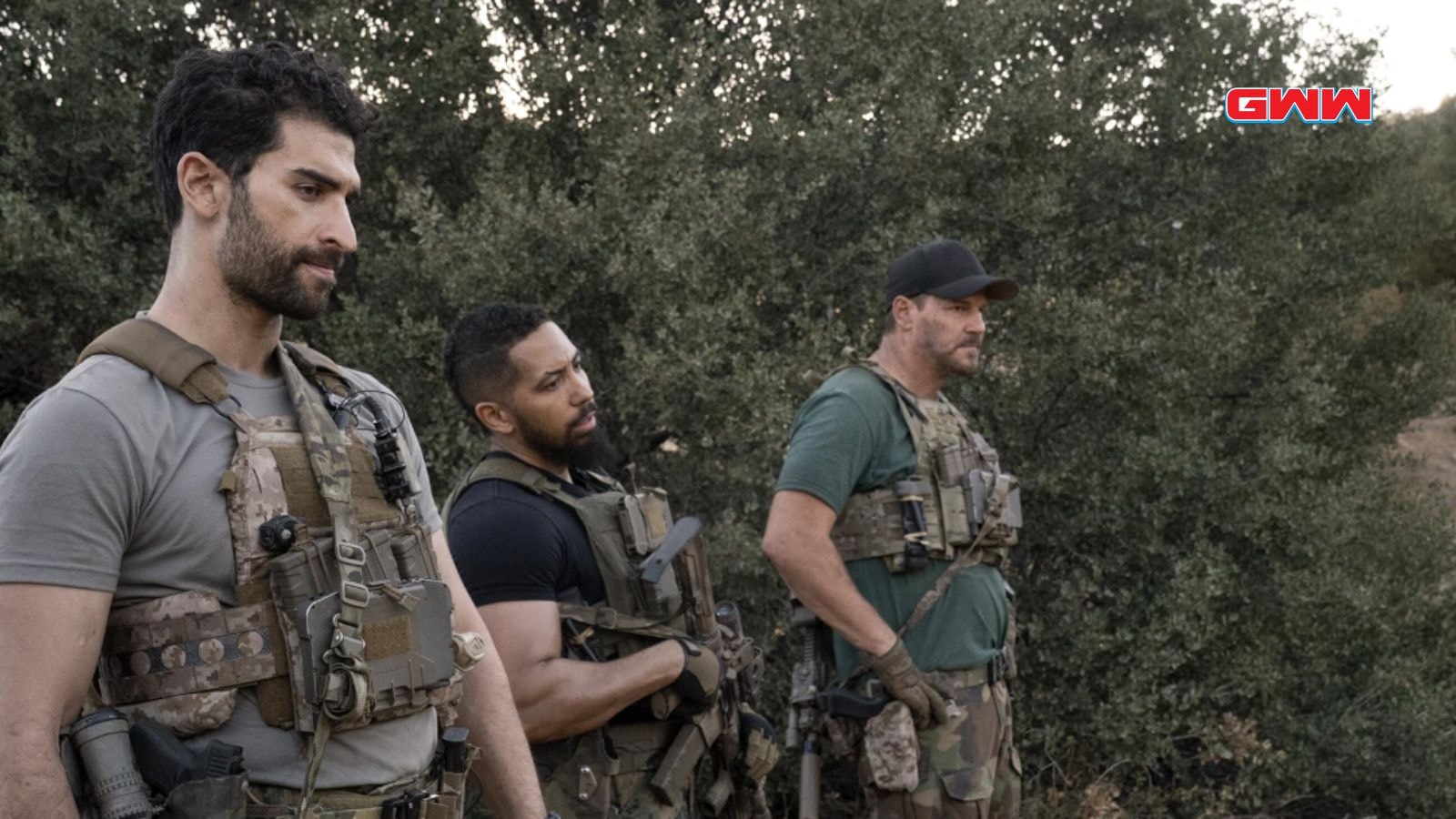 Jason, Raymond, and Omar in tactical gear stand focused during a mission.