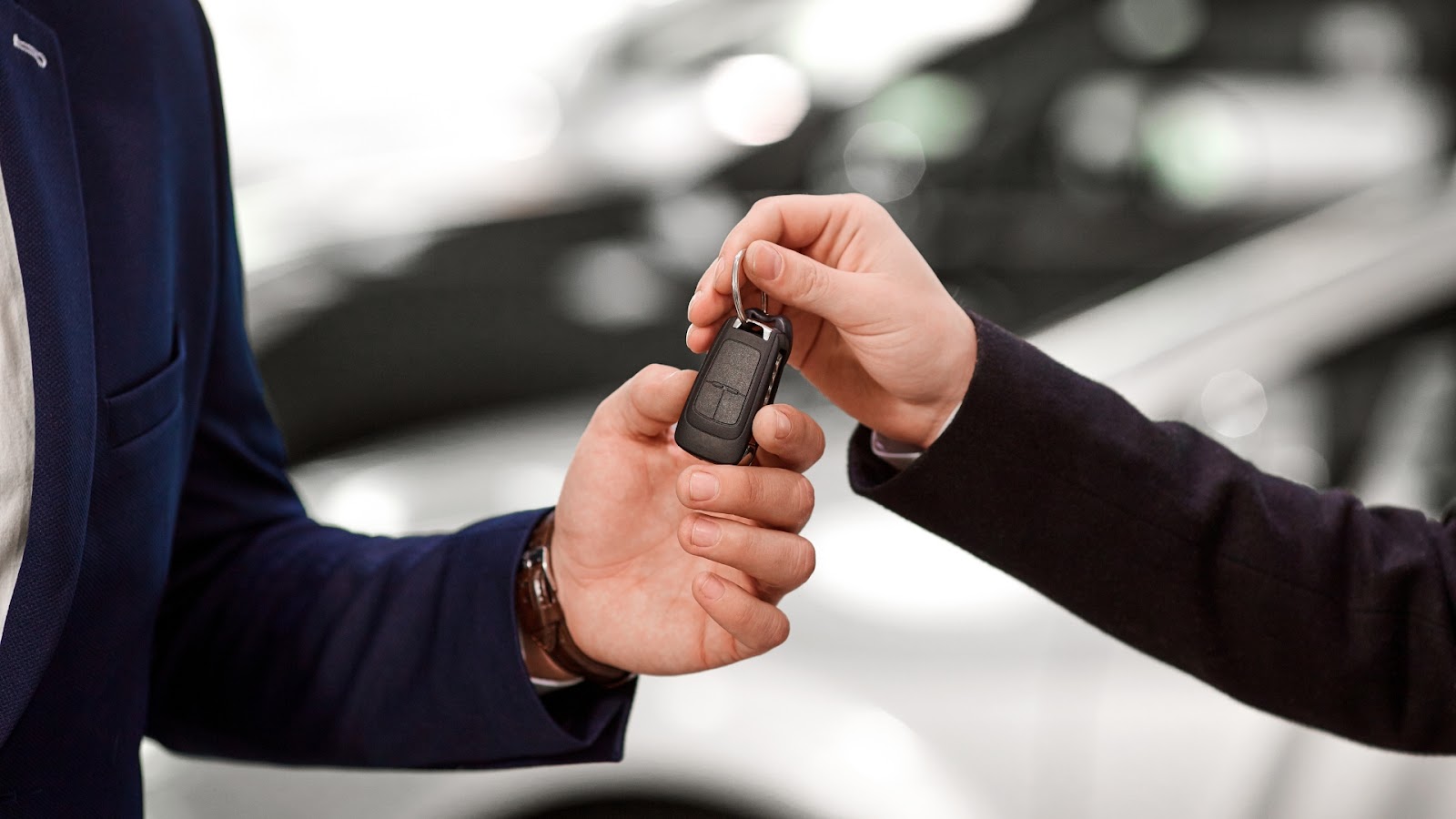 A client is getting a new car key replacement for a lost key.