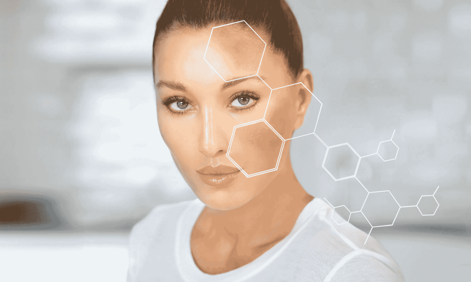 Woman with clear skin and digital hexagonal graphics over her face, illustrating skin analysis for post-inflammatory hyperpigmentation (PIH) treatment.