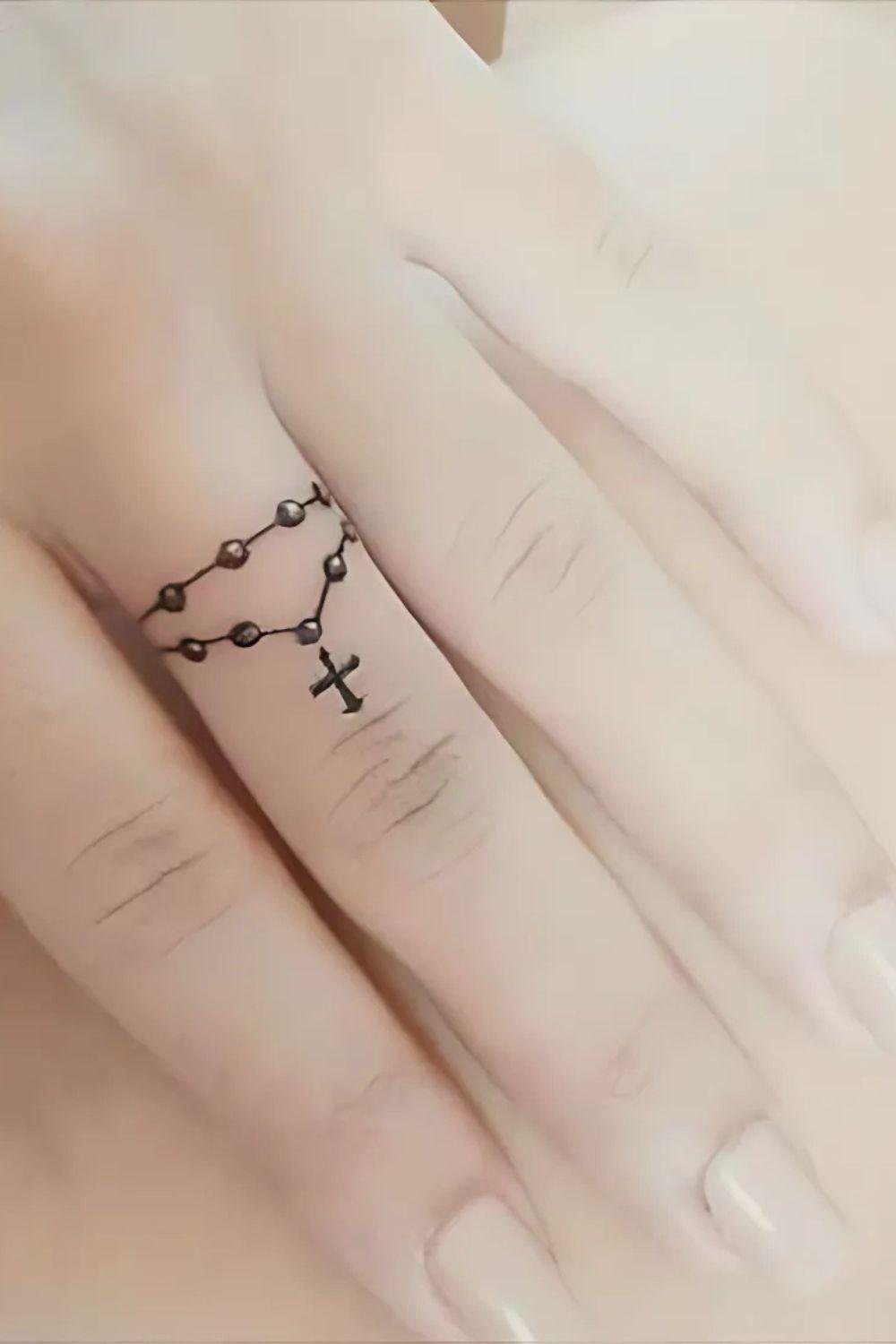 Cross Finger Tattoo