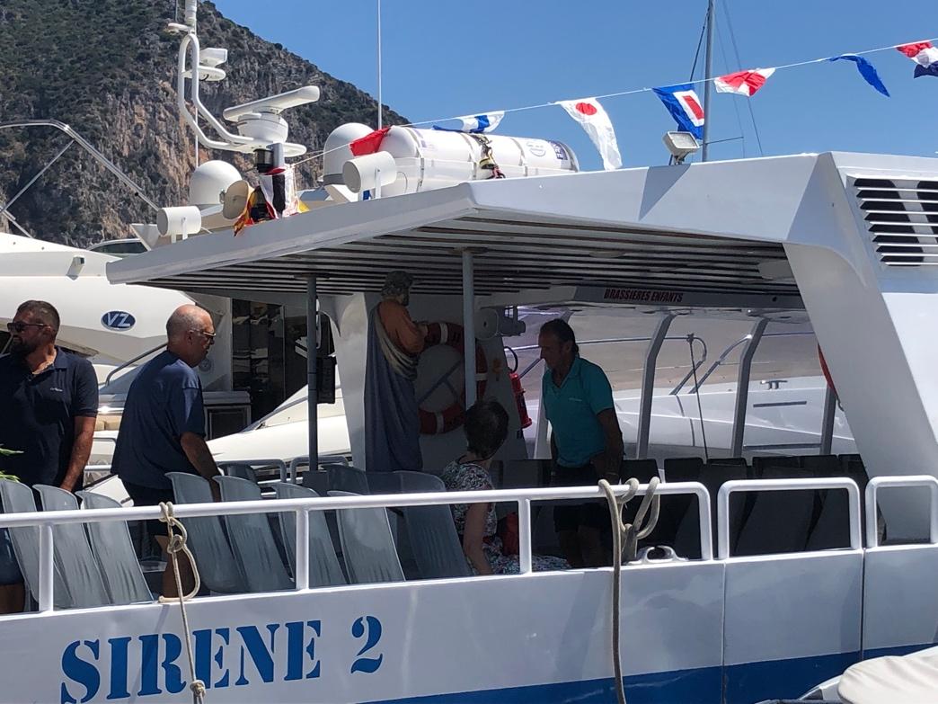 A group of people on a boat

Description automatically generated
