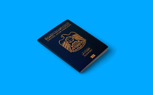 Passport of United Arab Emirates with blue background Passport of United Arab Emirates on the top of an blue background Right Visa Type for Your Dubai Visit stock pictures, royalty-free photos & images