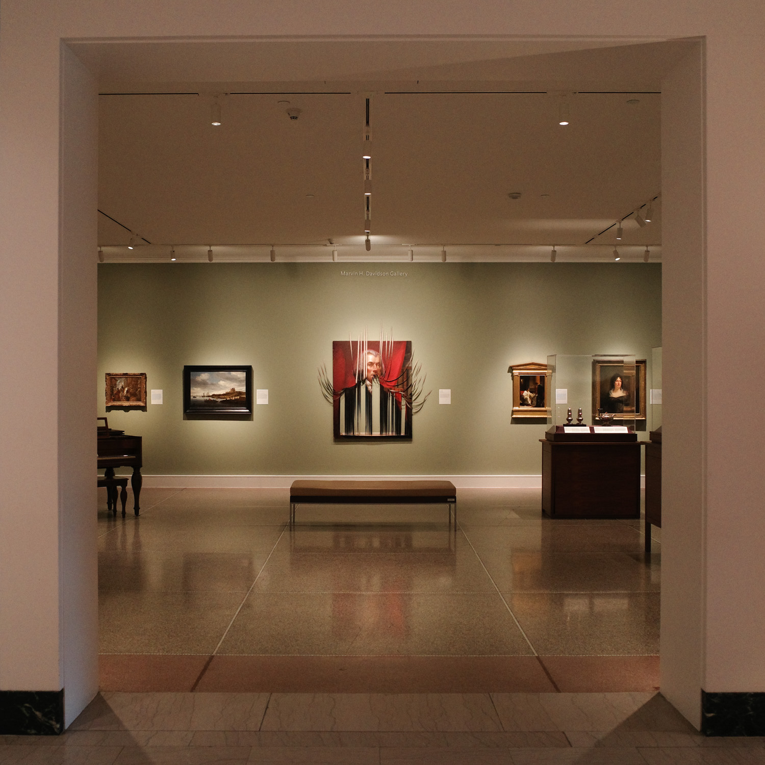 View of room with art exhibition.